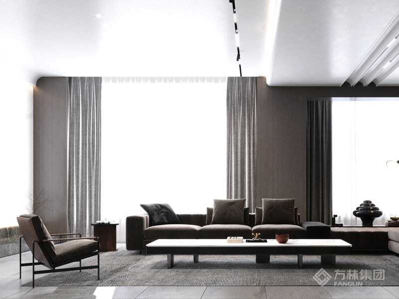 沙发呈围合之势限定范围，处于同一空间的客餐厅之间保有一定的区域感。暖色系沙发特有的视觉柔和与材质触感的温柔是和空间气质的互补，酷炫的空间不乏温度。